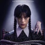 Wednesday Addams (Jenna Ortega) on the official Season 2 poster, tied with Thing on her shoulder, looking unimpressed.