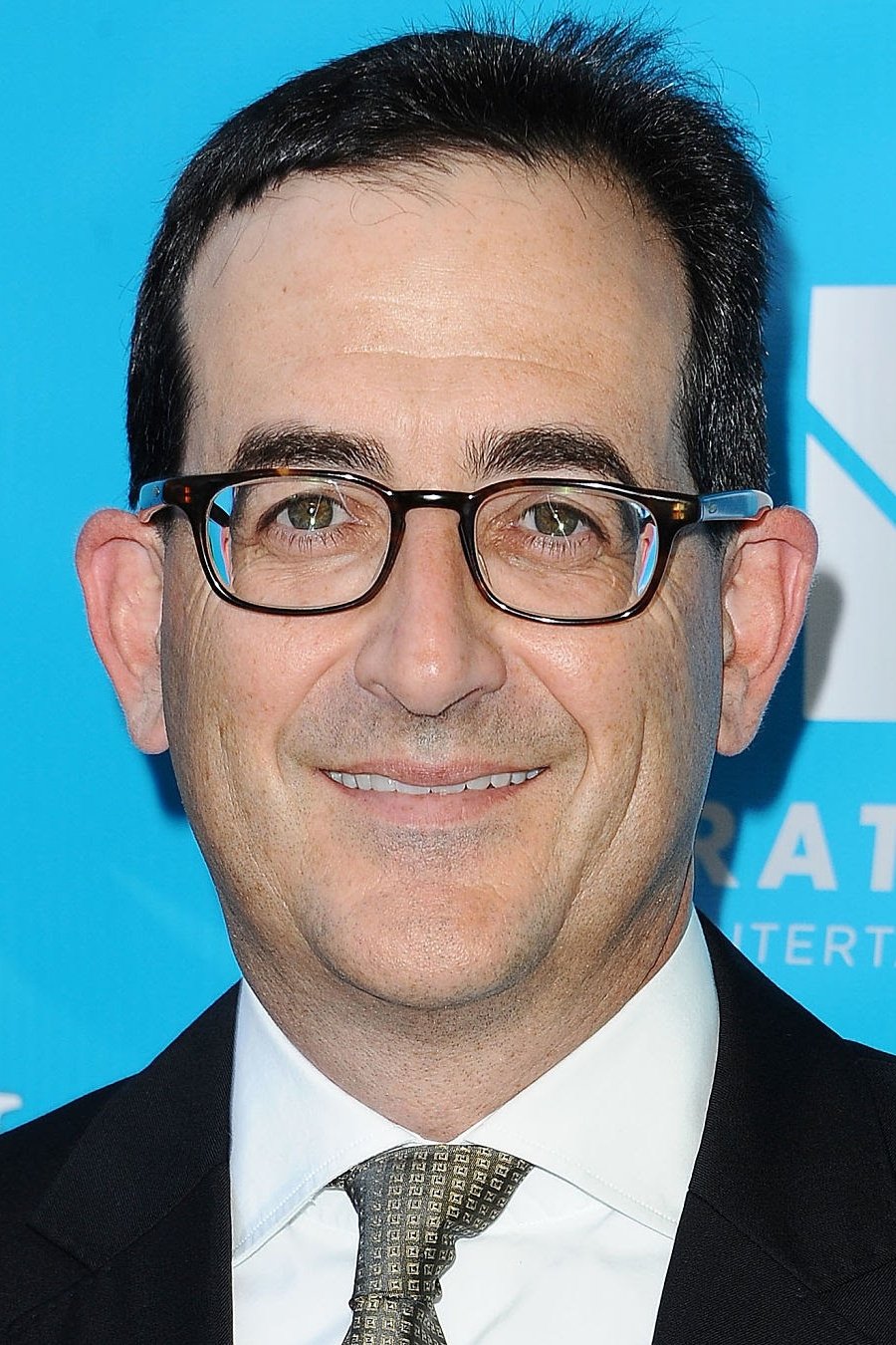 A headshot of Paul Neinstein.