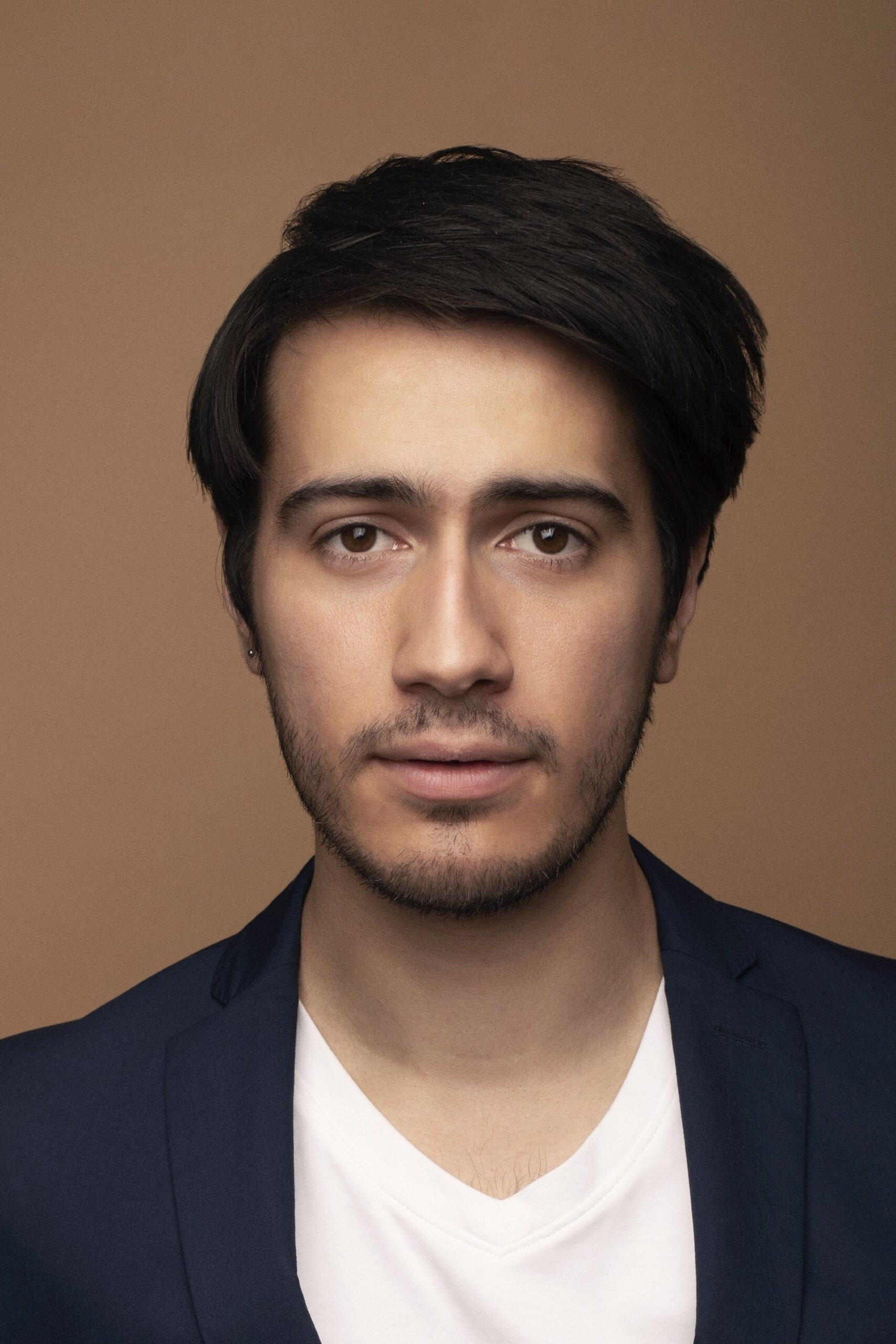 A headshot of Dario Ladani Sanchez.