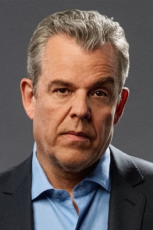 A headshot of Danny Huston.