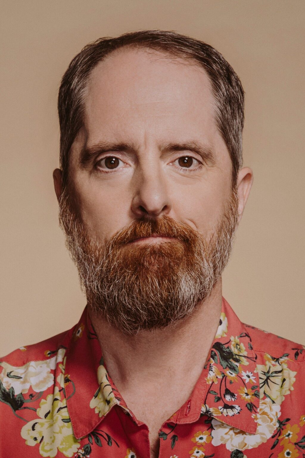 A headshot of Brendan Hunt.