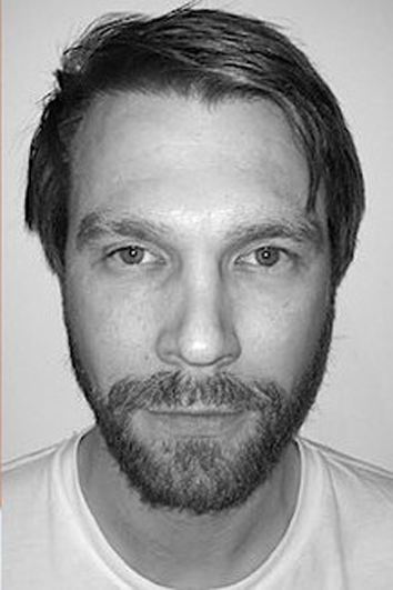 A headshot of Michael Homick.