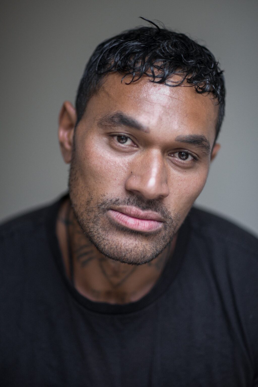 A headshot of CJ. Bloomfield.