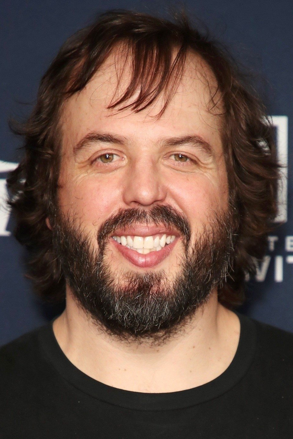 A headshot of Angus Sampson.