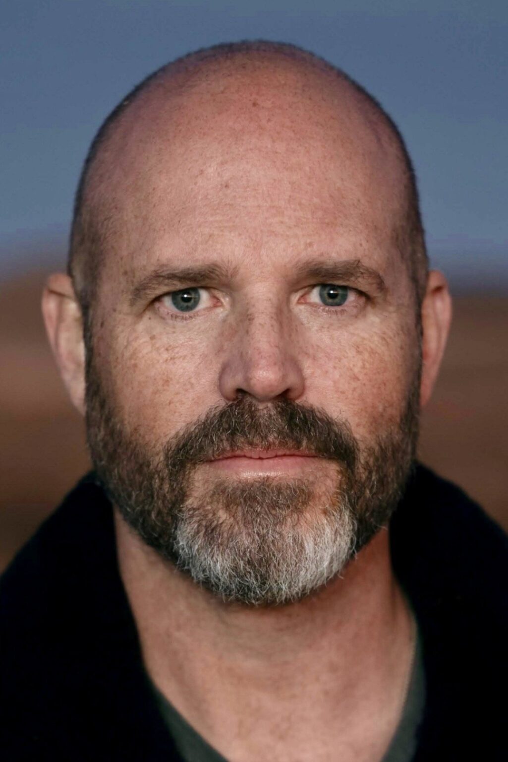 A headshot of David Denman.