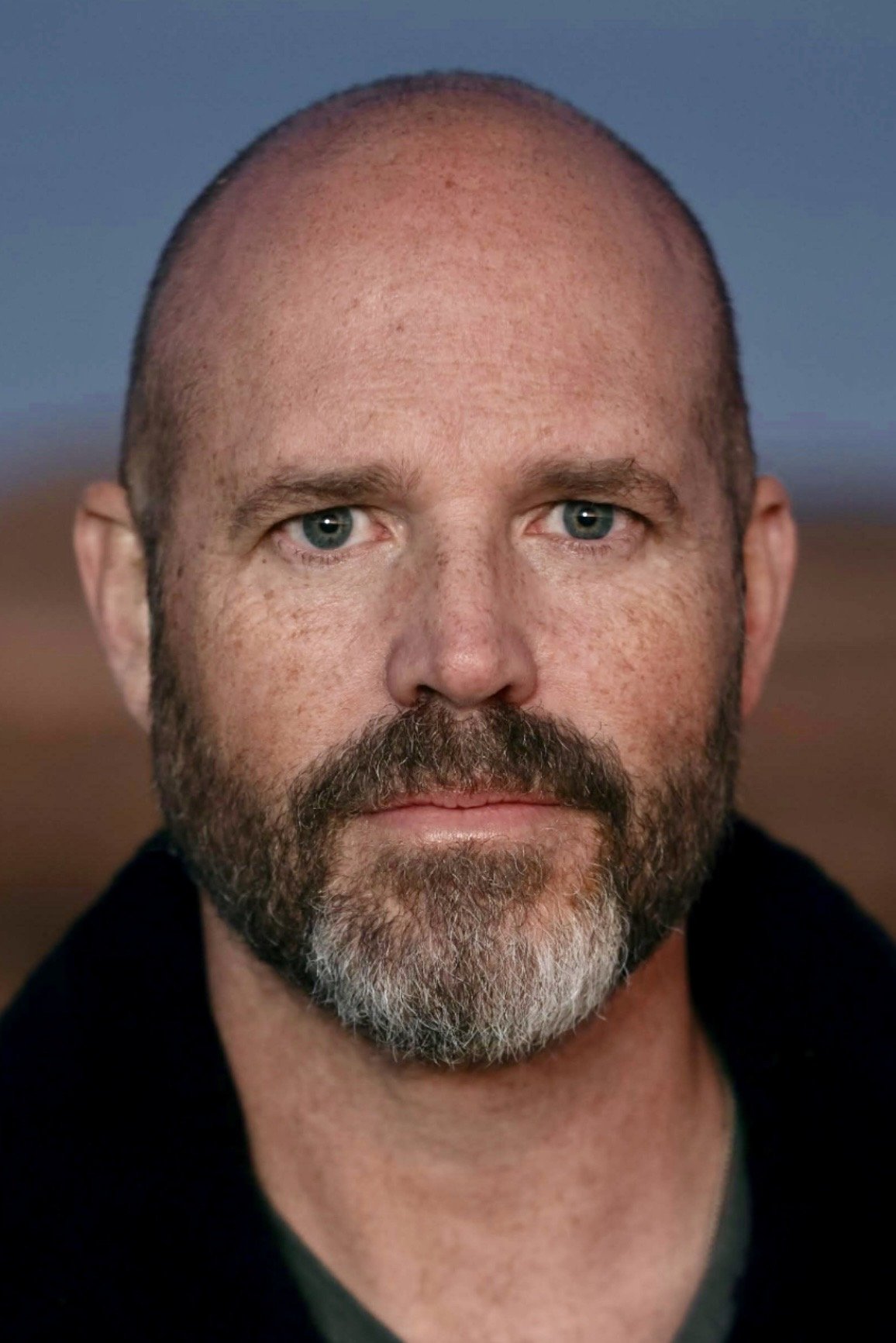 A headshot of David Denman.