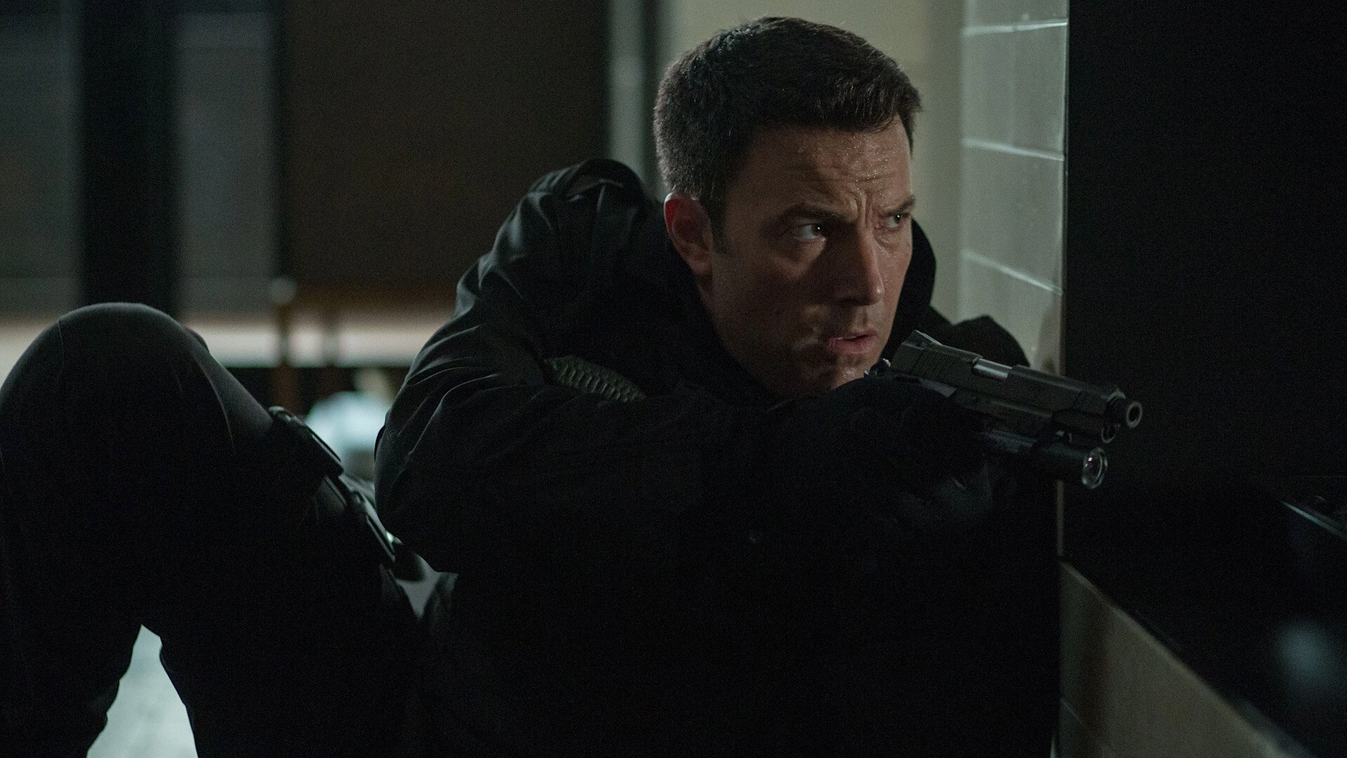 Movie still from The Accountant (2016). Christian Wolff (Ben Affleck) in a tense moment, likely mid-mission, showcasing his sharp focus in The Accountant.