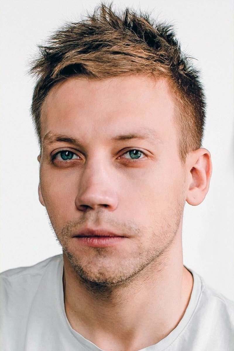 A headshot of Aleksandr Kuznetsov.
