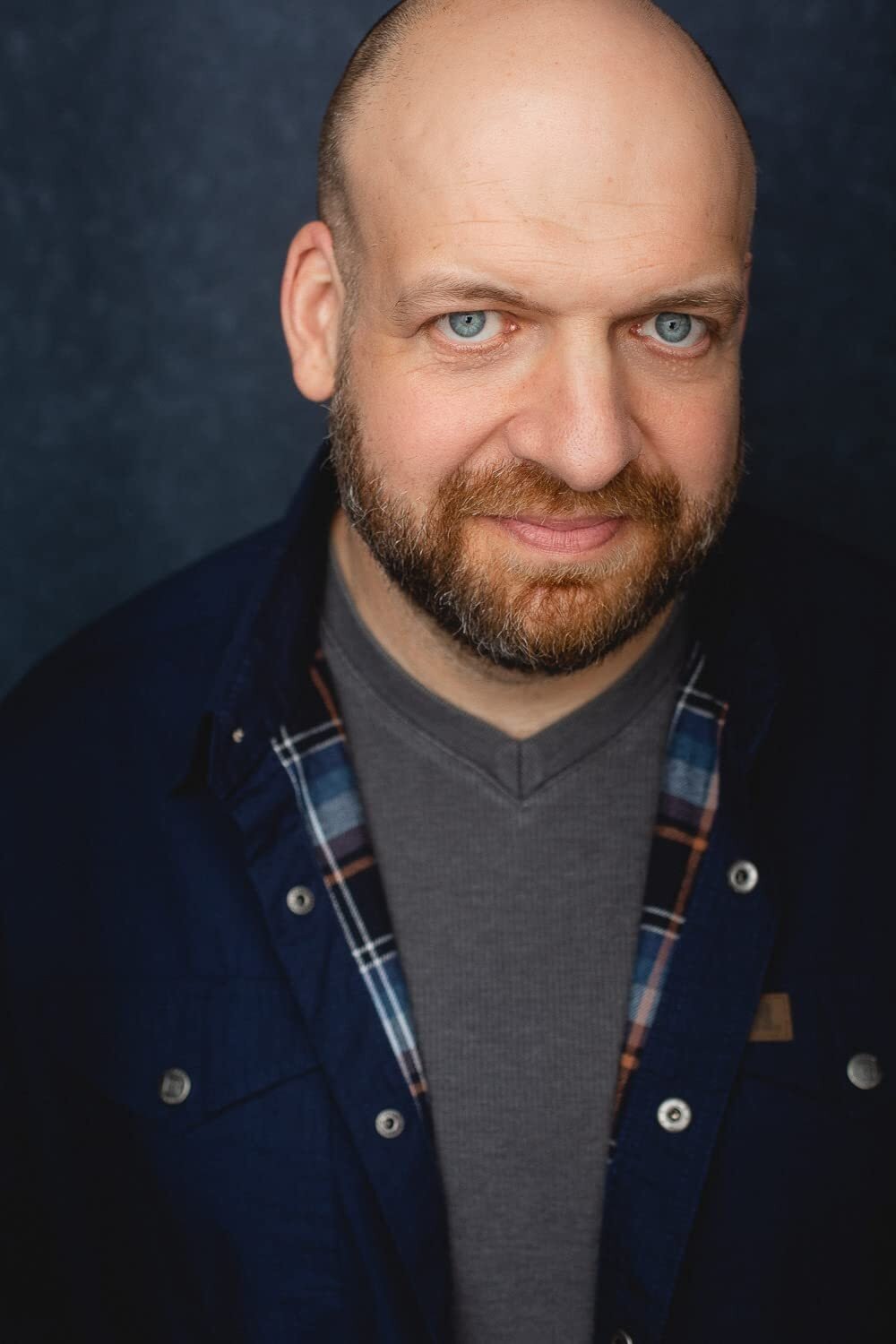 A headshot of Michael Tourek.