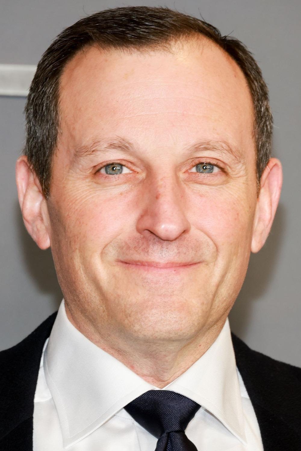 A headshot of William Sherak.