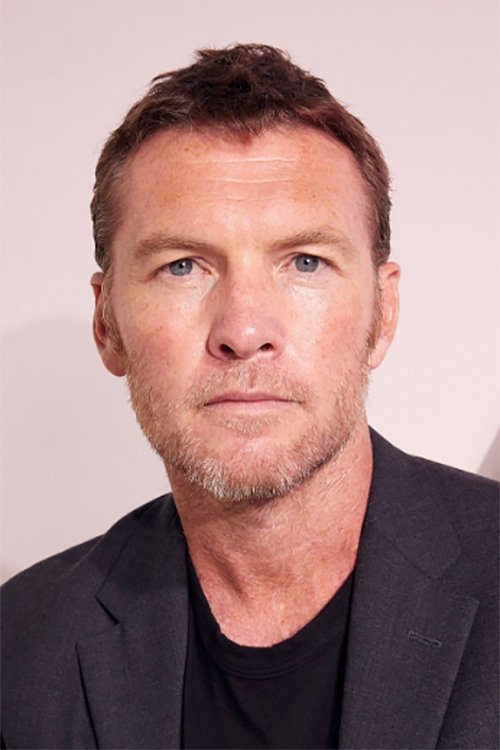 A headshot of Sam Worthington.