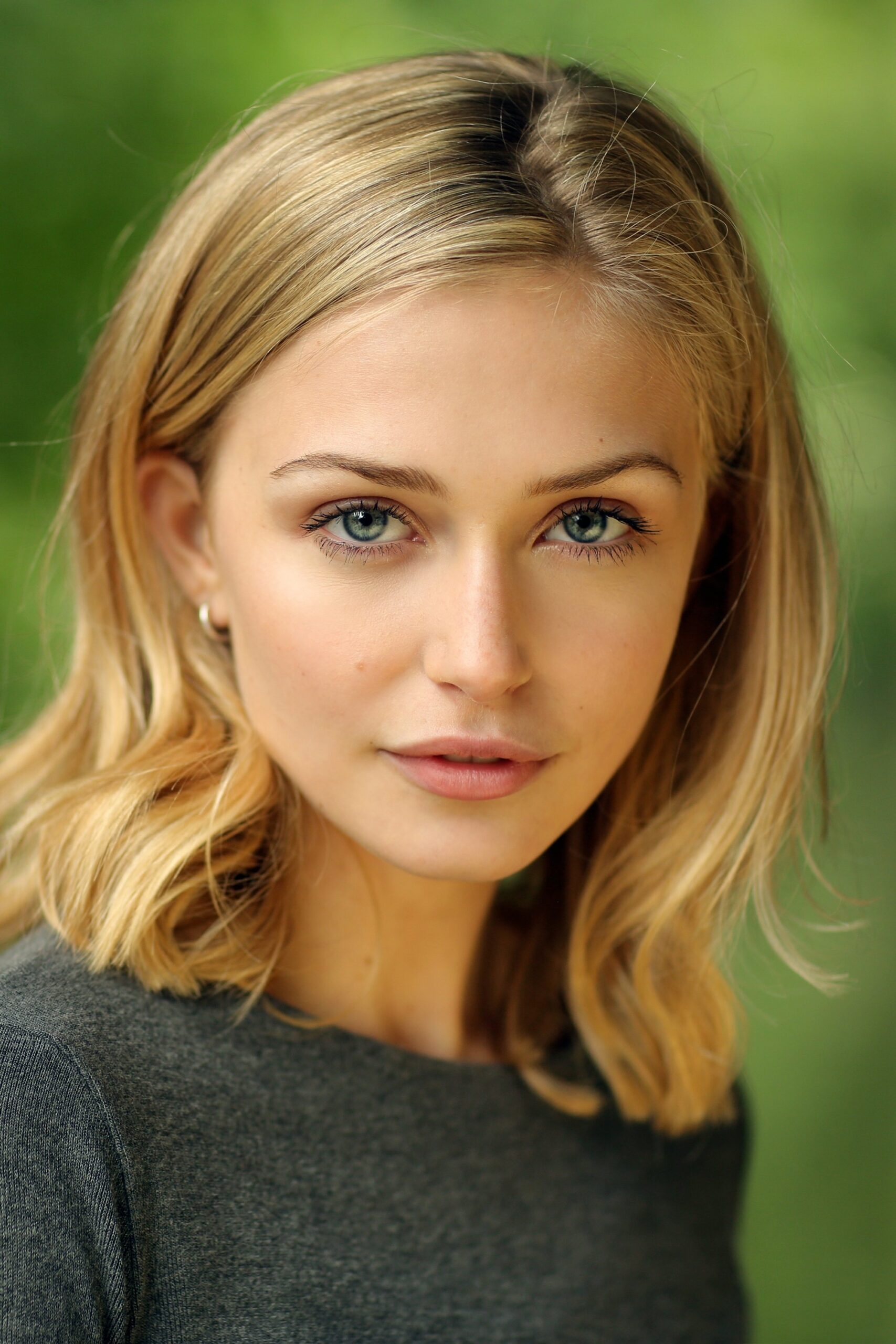 A headshot of Sophie Simnett.