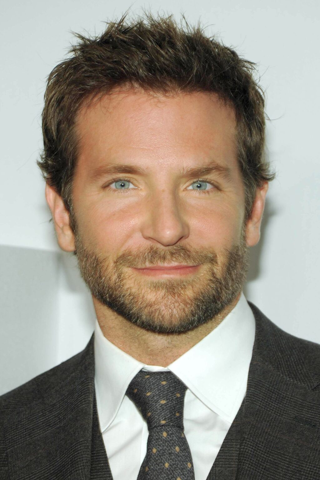 A headshot of Bradley Cooper.