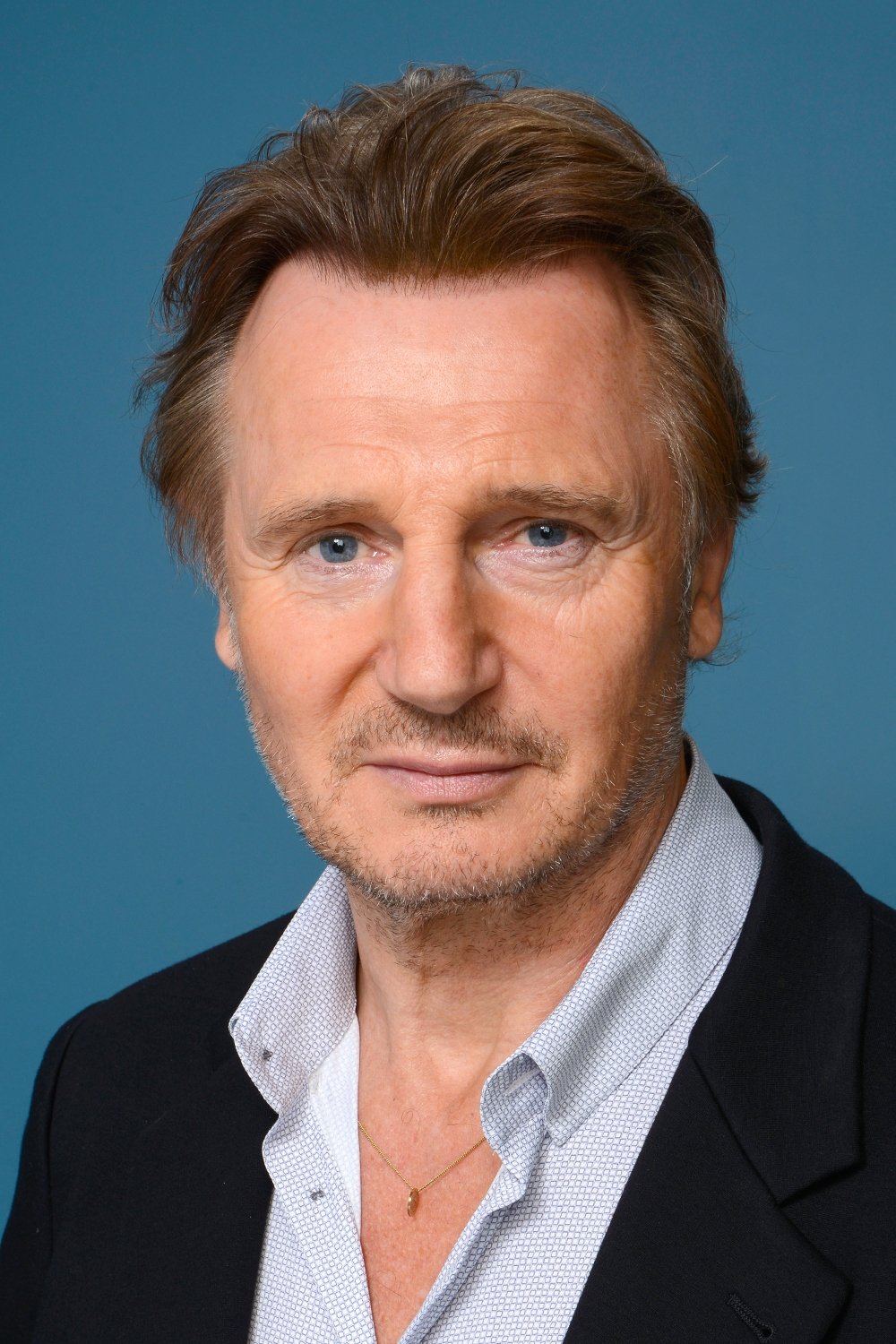 A headshot of Liam Neeson.