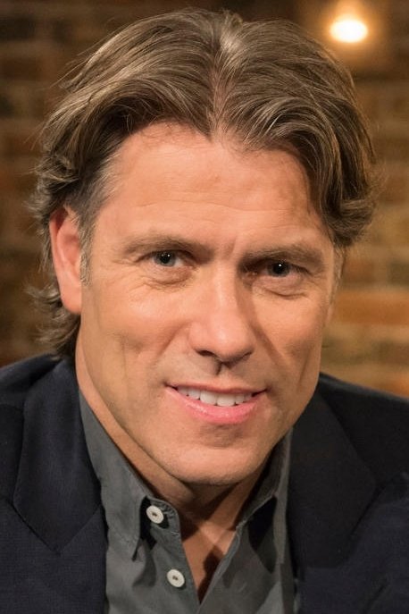 A headshot of John Bishop.