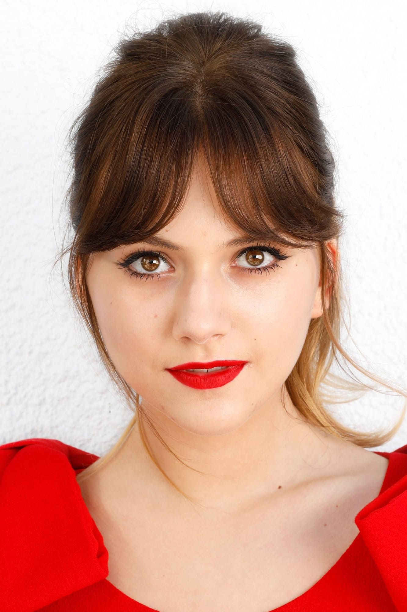 A headshot of Emilia Jones.