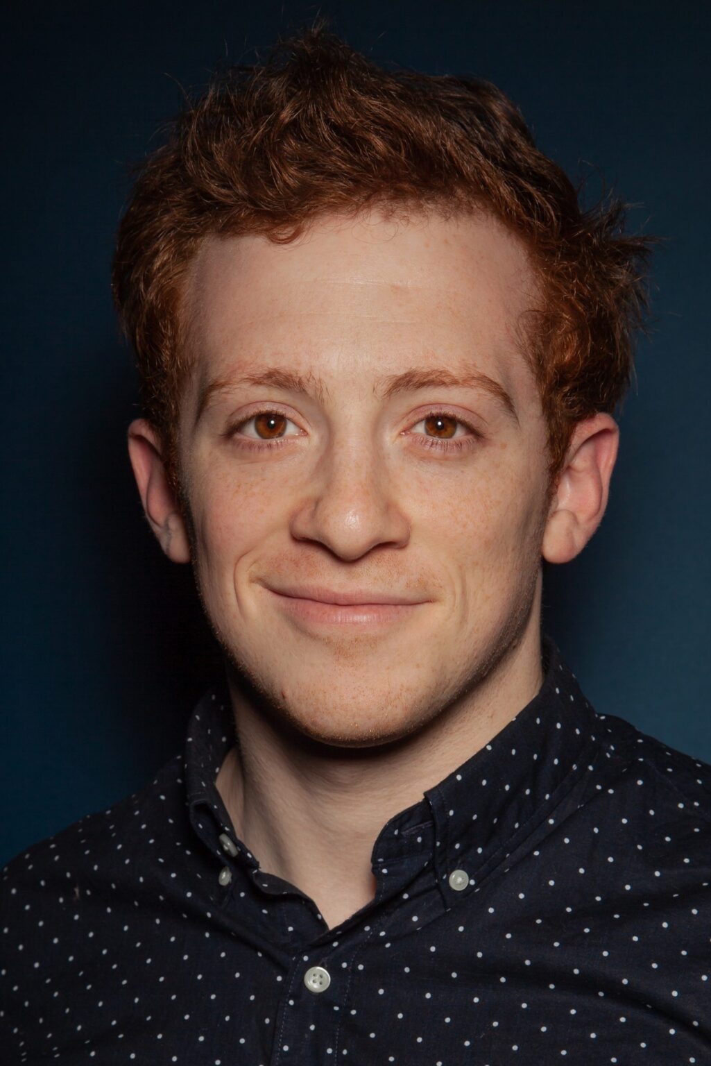 A headshot of Ethan Slater.