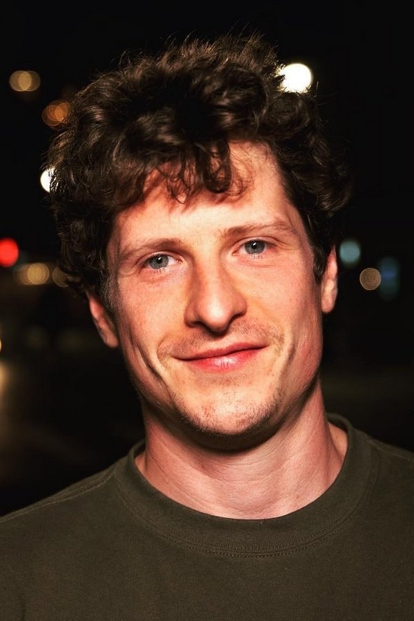 A headshot of Michael Rowland.