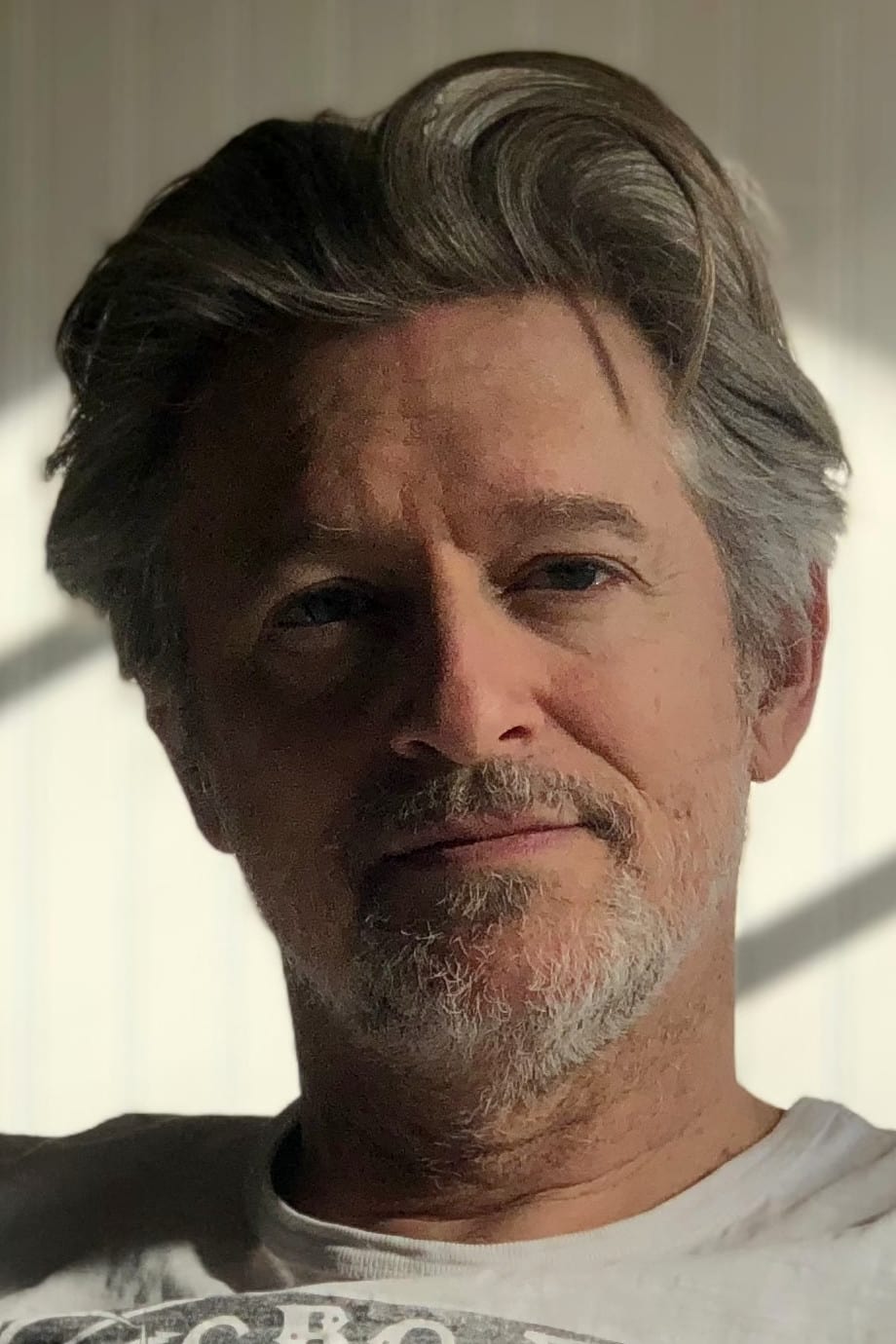 A headshot of Adam Kane.