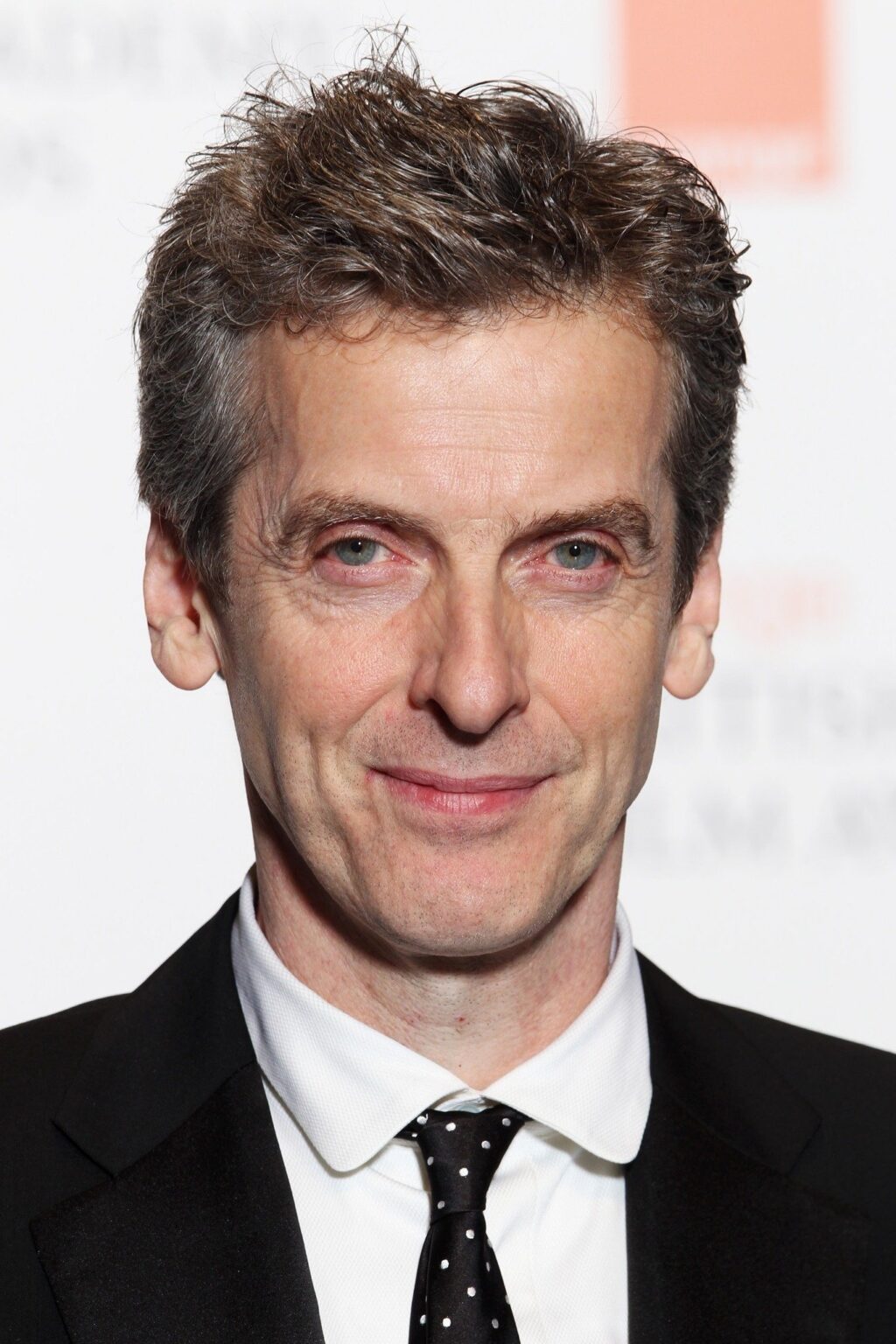 Official headshot photo of person: Peter Capaldi.