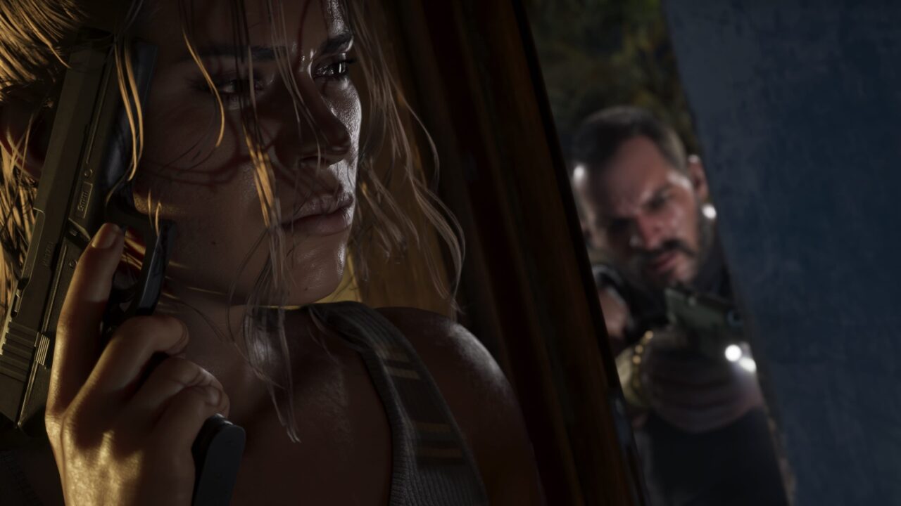 Close-up of Lucia from GTA 6, holding a handgun, with a determined or intense expression, and a blurred male figure possibly Jason in the background.