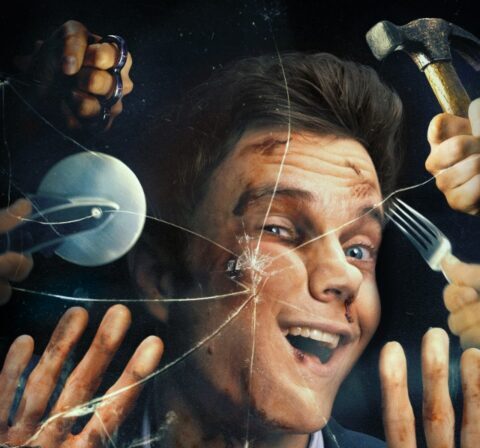 The official movie poster for Novocaine, featuring Jack Quaid's face behind cracked glass, with various hands holding weapons like a hammer and brass knuckles approaching him. The film title "NOVOCAINE" is prominently displayed at the bottom.