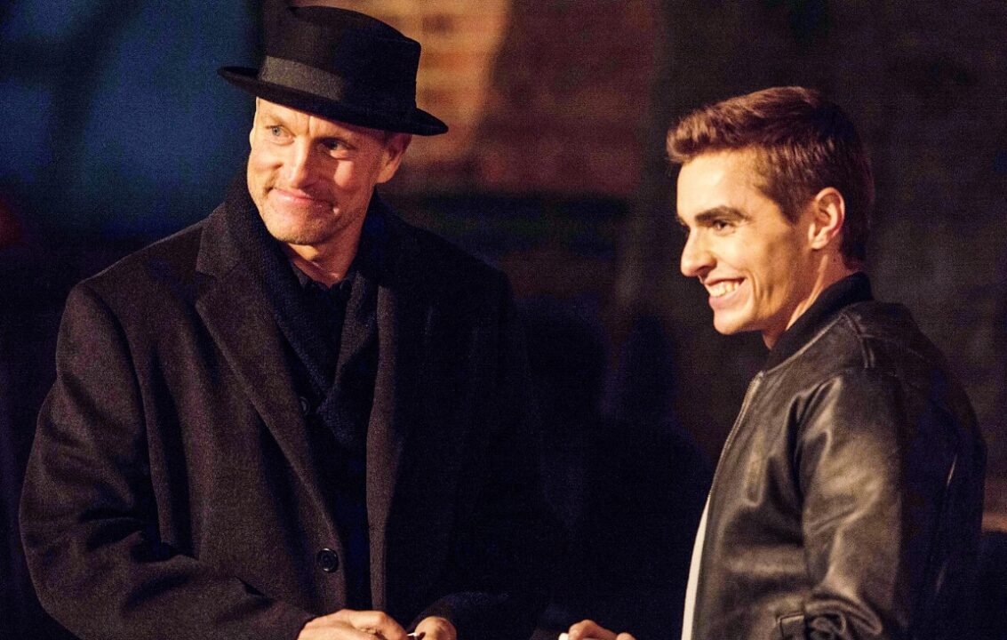 Merritt McKinney (Woody Harrelson) in a hat and Jack Wilder (Dave Franco) smiling, from a scene in Now You See Me 2.