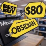Yellow price tags in a store display, showing 'BEST BUY', '$80', and 'OBSIDIAN', with 'Microsoft' branding visible in the background, symbolizing high video game prices.