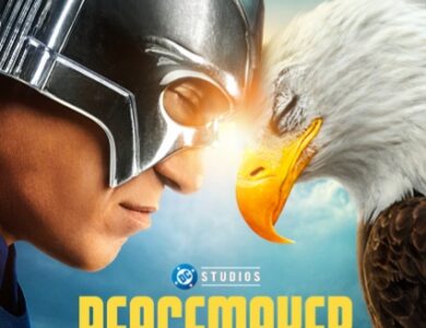 The official Peacemaker Season 2 poster featuring a close-up of Peacemaker's chrome helmeted head facing an American bald eagle (Eagly), nose-to-beak, against a blue sky. The show title 'PEACEMAKER' is prominent.