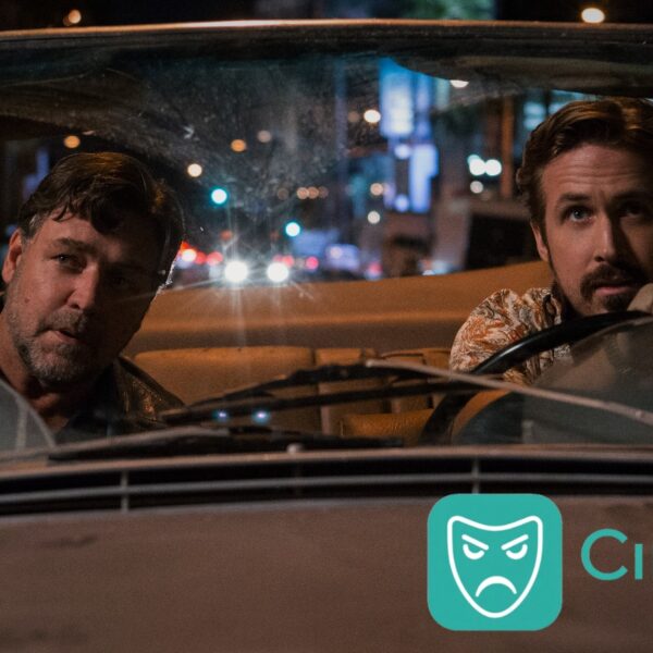 Russell Crowe and Ryan Gosling in a car at night, looking forward, with the Cinesist logo visible in the bottom right corner.