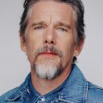 A headshot of Ethan Hawke.