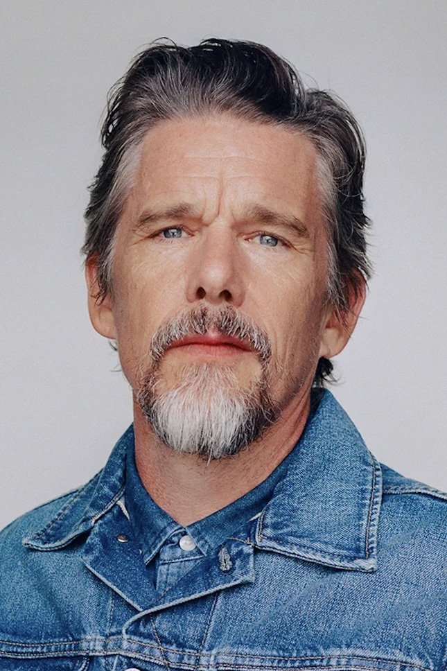 A headshot of Ethan Hawke.