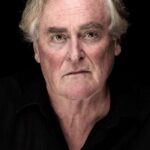 A headshot of John Howard.