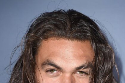 A headshot of Jason Momoa.