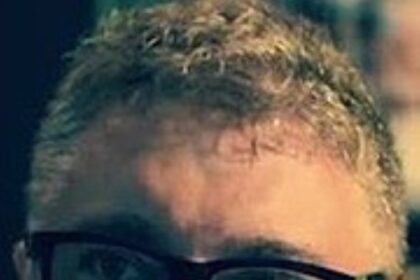 A headshot of Enrique Chediak.