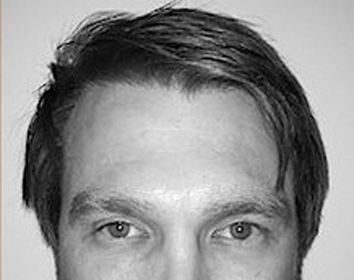 A headshot of Michael Homick.