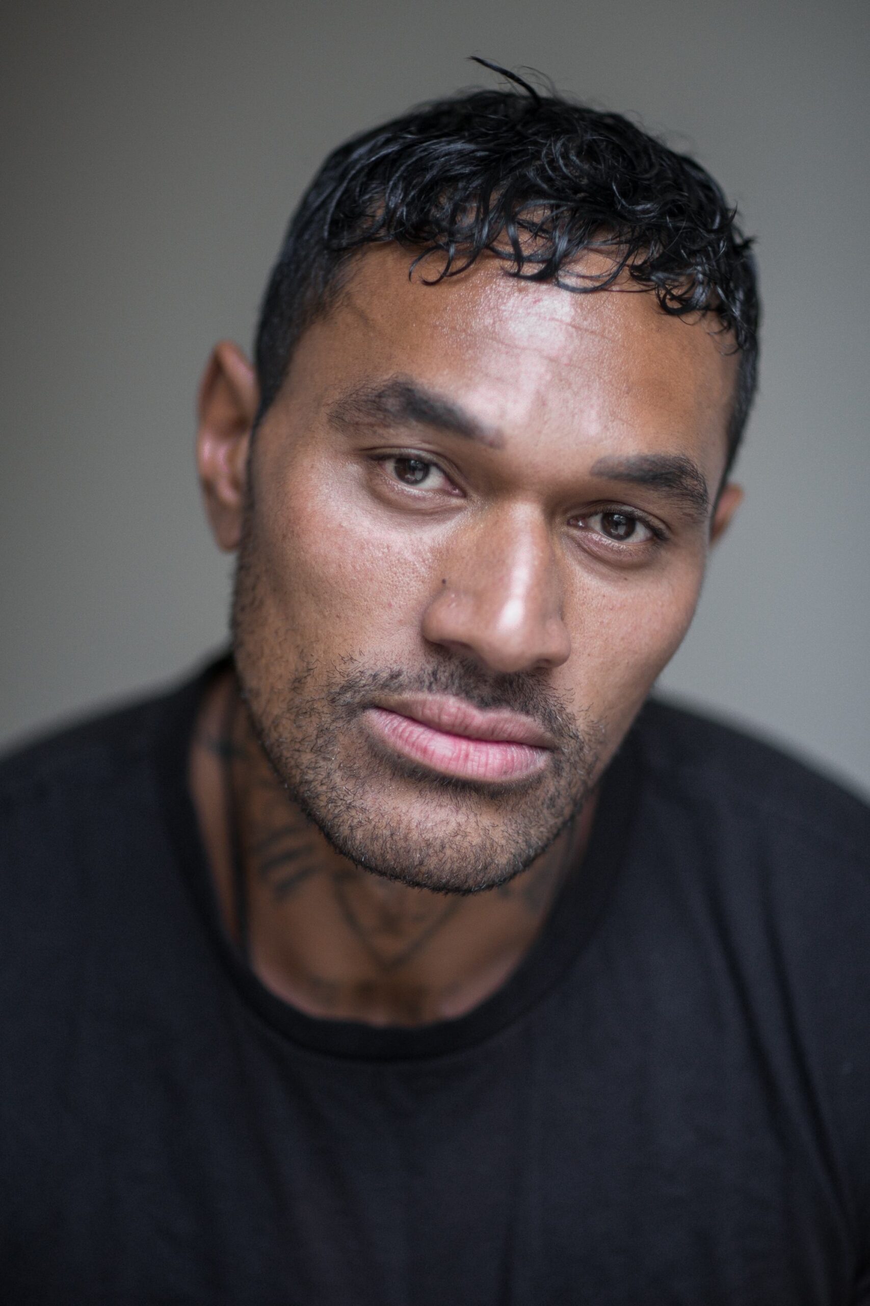 A headshot of CJ. Bloomfield.