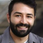 A headshot of Adrian Molina.