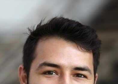 A headshot of Adrian Molina.