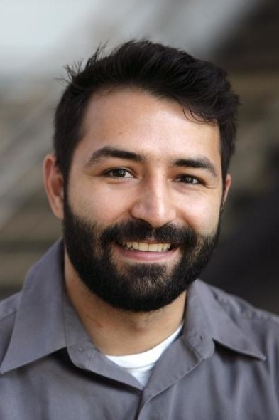 A headshot of Adrian Molina.