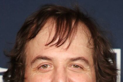 A headshot of Angus Sampson.