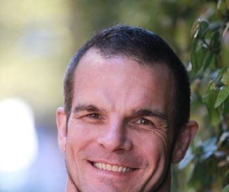 A headshot of Ian Roberts.