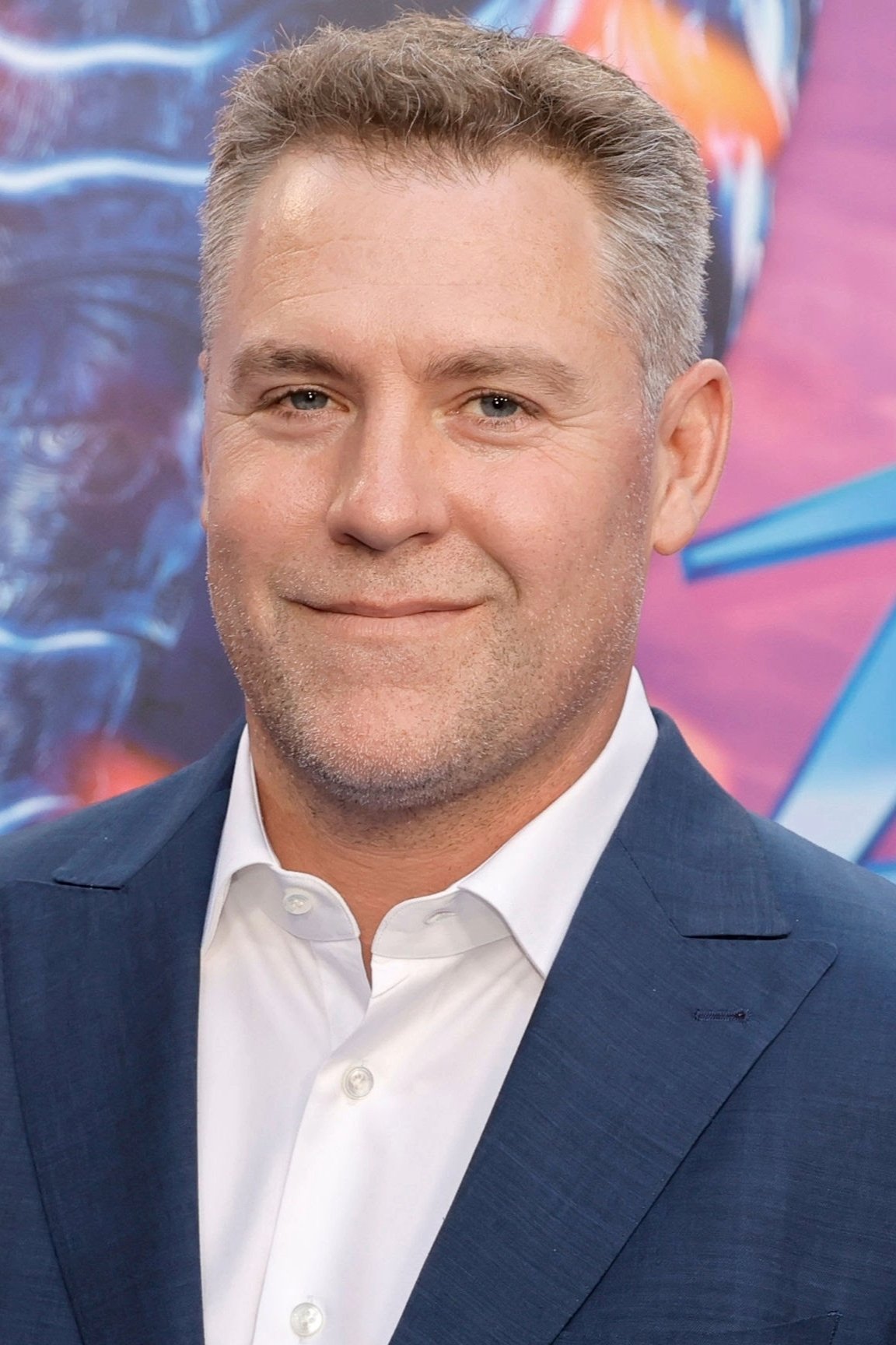 A headshot of John Rickard.