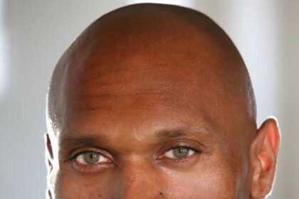 A headshot of Mark Rhino Smith.