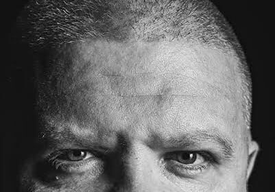 A headshot of George Carroll.