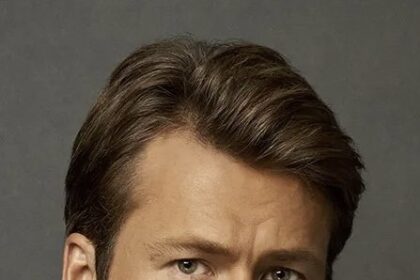 A headshot of Glen Powell.