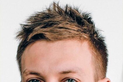 A headshot of Aleksandr Kuznetsov.