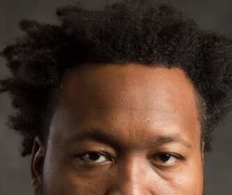 A headshot of Adrian McLean.