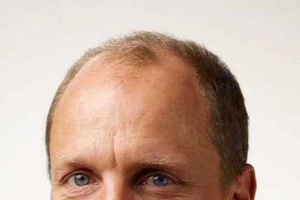 A headshot of Woody Harrelson.