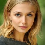 A headshot of Sophie Simnett.